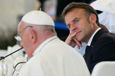 French President Emmanuel Macron and Pope Francis take part in a G7 summit in southern Italy