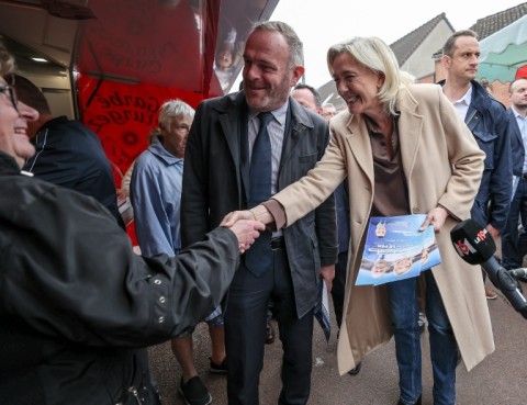 French far-right figurehead Marine Le Pen meets local residents during a campaign visit to the northern town of Henin-Beaumont