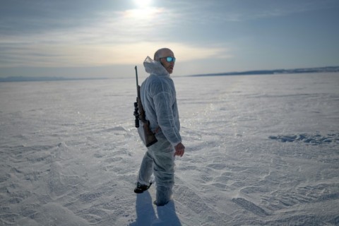 Inuit hunter Hjelmer Hammeken, 66, heads out alone onto the Greenland ice 