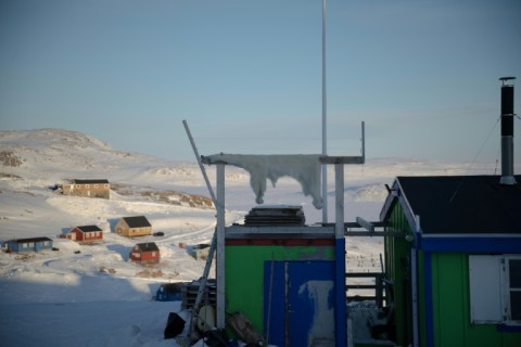 A polar bear skin dries in the freezing air of the Inuit village of Ittoqqortoormiit, Greenland