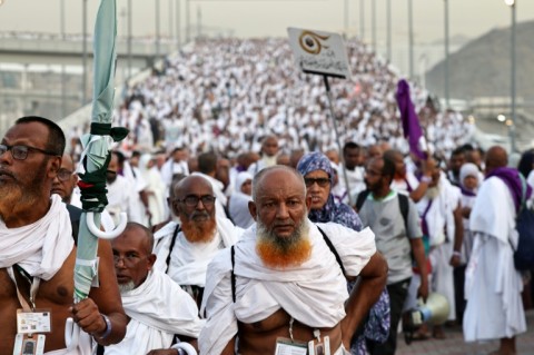 Pilgrims arrive to perform the symbolic 'stoning of the devil' ritual as part of the hajj