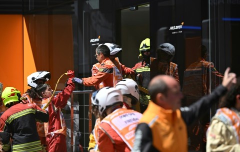 Firefighters at an incident at McLaren's hospitality unit before third practice