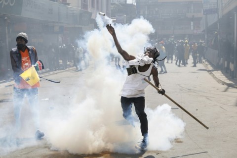 Protest organisers have called for further peaceful marches this week after unprecedented scenes left part of parliament ablaze on Tuesday