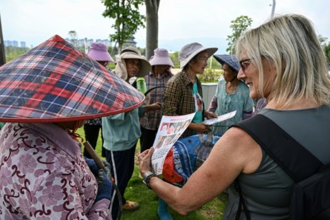 Corinne Wilson (R), Loulee's adoptive mother, founded The Roots of Love, an organisation set up to reconnect adoptees with relatives in China