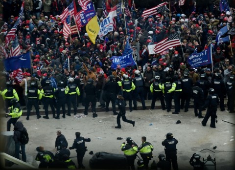 Police hold back supporters of US president Donald Trump outside the US Capitol on January 6, 2021