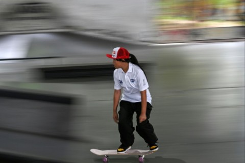 Thailand's 12-year-old skateboarder Vareeraya Sukasem trains at Hua Mak skate park in Bangkok ahead of this month's Olympics