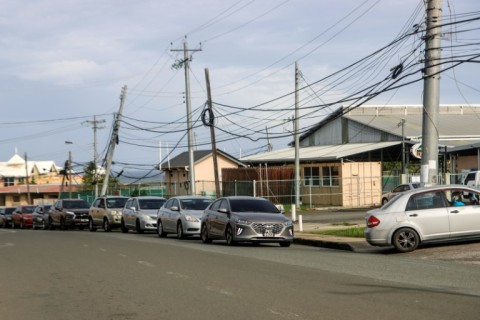 Drivers queue to fill their tanks outside a gas station in Scarborough, Trinidad and Tobago on June 30, 2024 as they prepare for the arrival of Hurricane Beryl