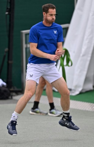 Looking for 'closure':  Andy Murray warms up during a training session 