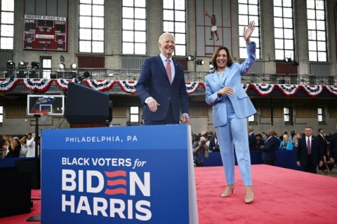 US Vice President Kamala Harris (R) said she was proud to be President Joe Biden's running mate