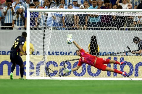 Argentina goalkeeper Emi Martinez saves from Ecuador's Alan Minda in Thursday's Copa America quarter-final thriller