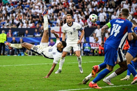 England's Jude Bellingham (left)is free to play against Switzerland after only receiving a suspended ban and fine for his gesture against Slovakia