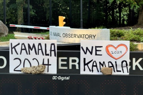 Supporters quickly cobbled together signs throwing their support behind Harris outside her official residence at the US Naval Observatory in Washington