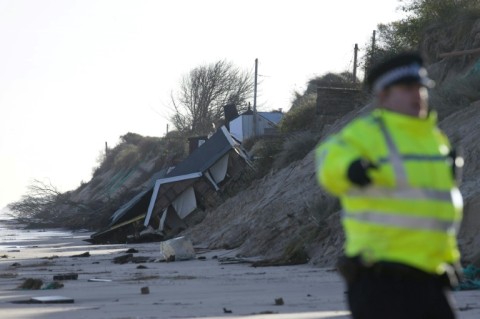 Hemsby, in Norfolk, eastern England, has been hit by tidal surges, washing houses in to the North Sea