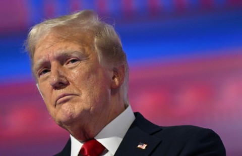 Former US president and 2024 Republican White House candidate Donald Trump stands on stage after accepting his party's presidential nomination 