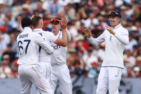 Success: England's Gus Atkinson (2L) celebrates with teammates after dismissing the West Indies' Alick Athanaze in the third Test at Edgbaston