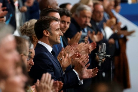 The ceremony is a much-needed boost for Macron