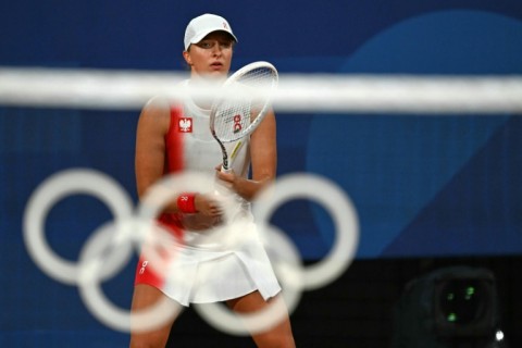 Winning start: Poland's Iga Swiatek prepares to receive while playing Romania's Irina-Camelia Begu