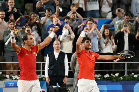 Dream team: Rafael Nadal and Carlos Alcaraz celebrate after beating Argentina's Maximo Gonzalez and Andres Molteni 