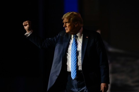 Former president Donald Trump raises his fist after finishing his keynote speech at the Bitcoin 2024 conference in Nashville, Tennessee