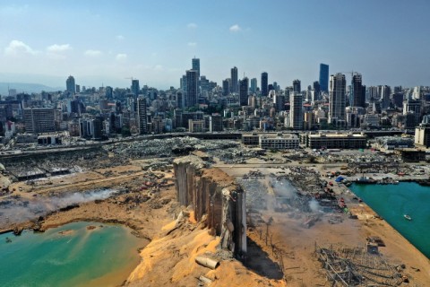 An aerial view on August 5, 2020 of the massive damage to Beirut port's grain silos (C) and surrounding area after a blast tore through the harbour in the heart of the Lebanese capital