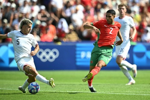 Morocco captain Achraf Hakimi fires in his side's third goal in their comfortable win over the United States in the Olympic men's football quarter-finals