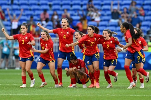 Spain celebrate beating Colombia on penalties in their Olympic football quarter-final in Lyon