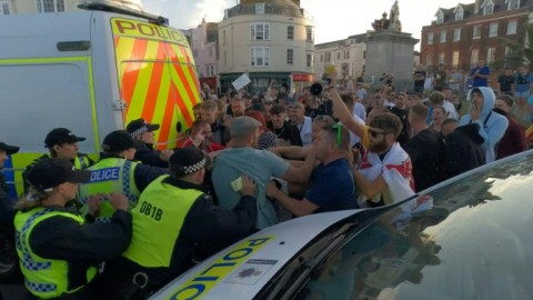 Far-right rioters clash with police during protests across UK cities