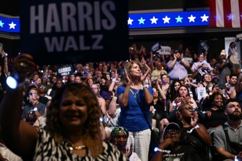 People cheer as Kamala Harris and Tim Walz arrive to speak 