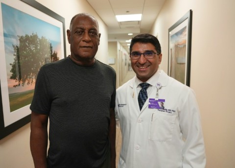 Doctor Satish Nadig (R), professor of surgery at the Northwestern University-Feinberg School of Medicine, poses with kidney transplant patient Harry Stackhouse, 74, at Northwestern Medicine in Chicago