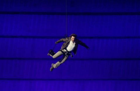 Hollywood star Tom Cruise descended from the roof of the Stade de France on a wire during the closing ceremony