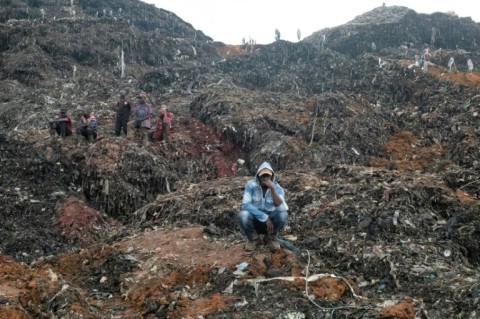 Mountains of garbage at the site in northern Kampala collapsed after heavy rains 