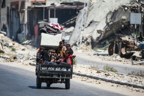 Palestinians flee Deir el-Balah, central Gaza, after the Israeli military issued fresh evacuation orders ahead of imminent military action