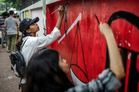 Students who led the weeks of protests that toppled autocratic premier Sheikh Hasina are painting over slogans calling on her to quit with messages of hope for the future