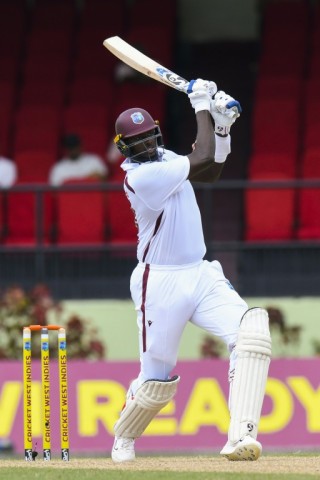 Key runs: Jason Holder hits a boundary for the West Indies 