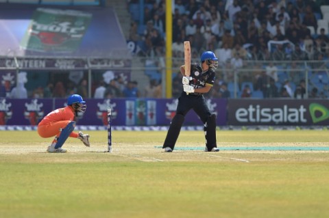 Afghan Cricket players from the Speen Ghar Tigers team (Orange) play against the Mis-e-Ainak Knights (Black) during Afghanistan's leading T20 cricket league 'Shpageeza' at the Kabul Cricket Stadium in Kabul, on August 22, 2024