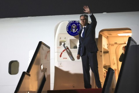 US Secretary of State Antony Blinken waves ahead of his departure from Doha on August 20, 2024
