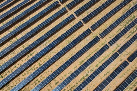 An aerial view shows solar panels at the fishing-solar complementary photovoltaic power generation base in Lianyungang, in eastern China's Jiangsu province