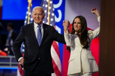 US President Joe Biden greets First Daughter Ashley Biden during the first day of the Democratic National Convention at the United Center on August 19, 2024 in Chicago, Illinois