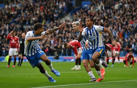 Brighton's Joao Pedro (R) celebrates scoring the winner against Manchester United