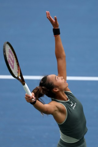 Zheng Qinwen serves in her US Open victory over Jule Niemeier