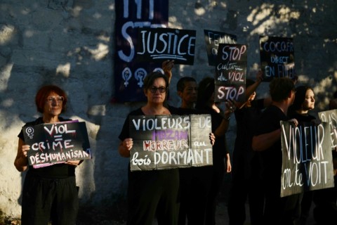 Demonstrators stage a protest during the trial in the southern city of Avignon of a man accused of drugging his wife Gisele Pelicot for nearly ten years and inviting strangers to rape her 