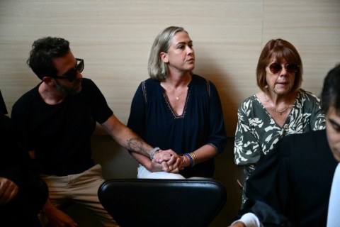 Caroline Darian (center) is attending the trial with her mother Gisele Pelicot (right) and two brothers