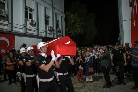 An honour guard carried the coffin of activist Aysenur Ezgi Eygi, who was killed in the West Bank 