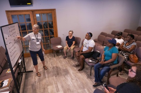 Volunteer teacher Hope Kaufman leads Haitian students during an English language class at the Haitian Community Help and Support Center in Springfield, Ohio