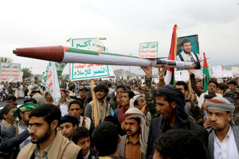 Yemeni demonstrators in April, 2024, carry a mock missile during a pro-Palestinian and anti-Israel rally in the Huthi rebel-held capital Sanaa