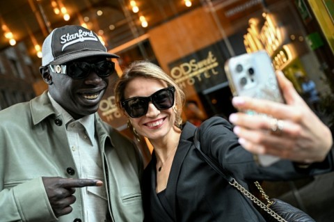 Khaby Lame poses for a selfie with a fan in Milan  
