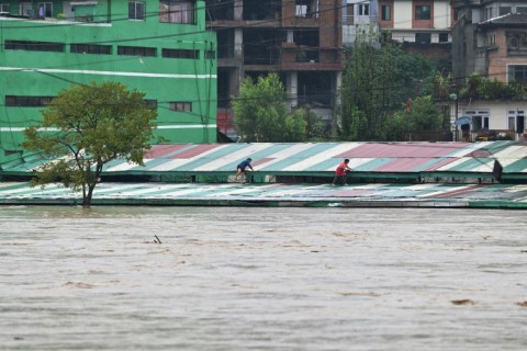 Areas of Kathmandu were flooded after the Bagmati River overflowed. Floods and landslides have killed at least 59 people across Nepal