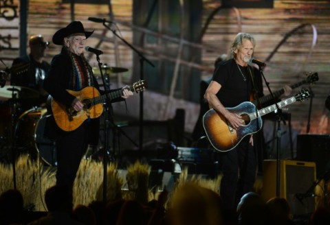 Willie Nelson (L) and Kris Kristofferson -- two of four members in The Highwaymen -- perform on stage at the 56th Grammy Awards in 2014