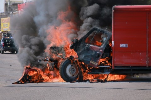 A truck burns in Culiacan, the capital of Sinaloa State, which has been shaken by a wave of murders, abductions and arson