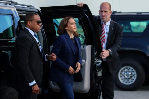 US Vice President and Democratic presidential nominee Kamala Harris greets New York State Democratic Party volunteers as she boards Air Force Two before departing from LaGuardia Airport in New York on October 9, 2024. Harris travels to Las Vegas, Nevada, for campaign events.